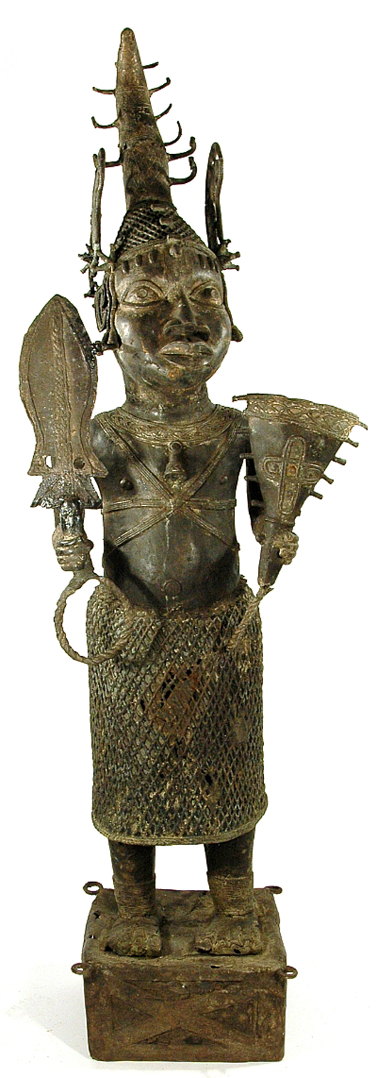 Benin-style brass standing figure of an Oba holding a staff and sword. Image courtesy Gray’s Auctioneers.